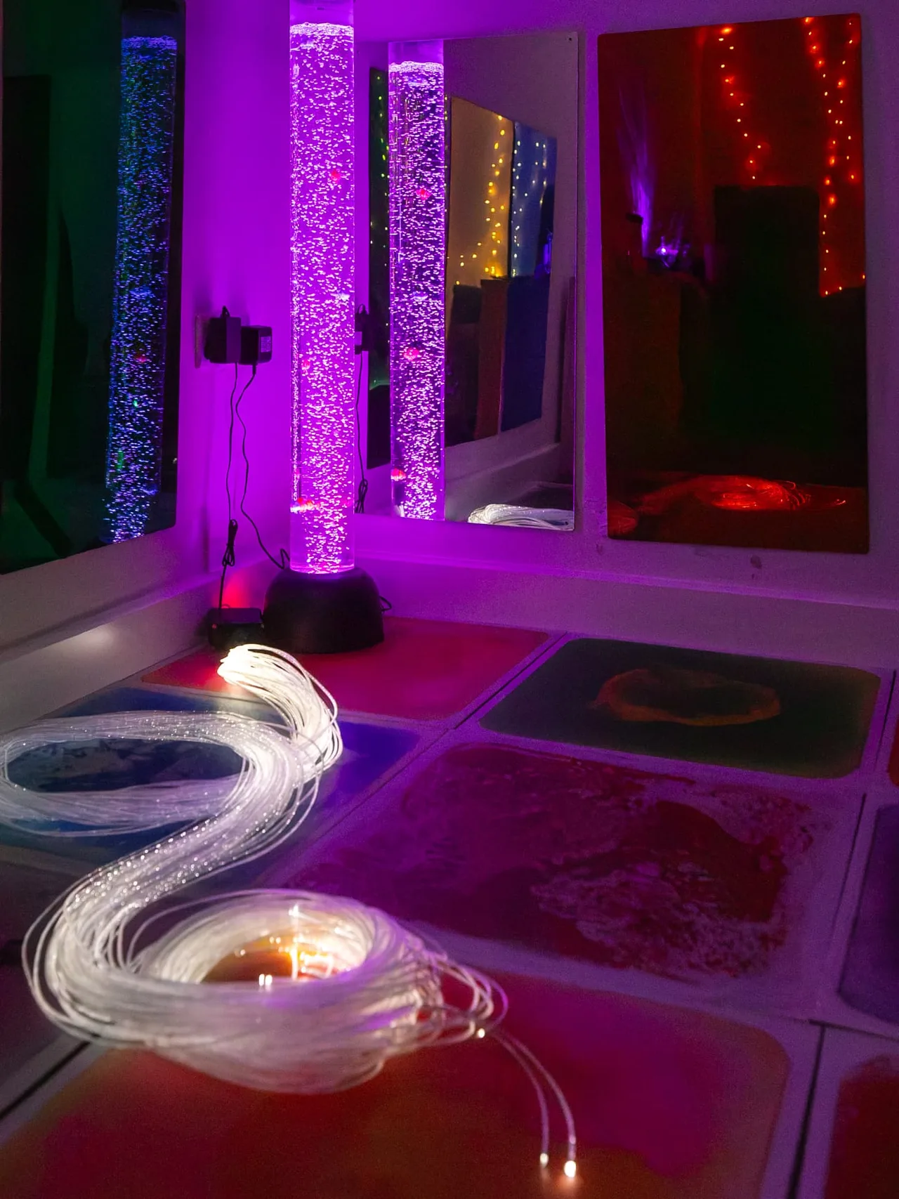 The glowing bubble tube and fibre-optic strands in the Connect sensory room